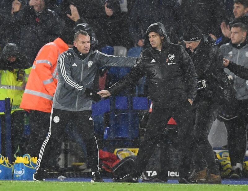 Arsenal manager Unai Emery and Leicester City manager Brendan Rodgers shake hands at the end of the game. EPA