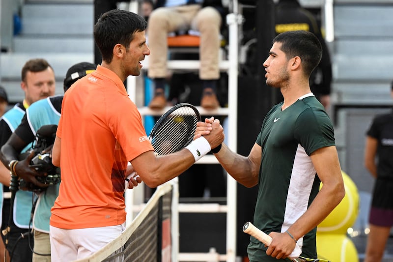 Carlos Alcaraz, right, and Novak Djokovic, left, contested their first match against each other at the Madrid Masters semi-finals this year, which Alcaraz won after three close sets. AFP