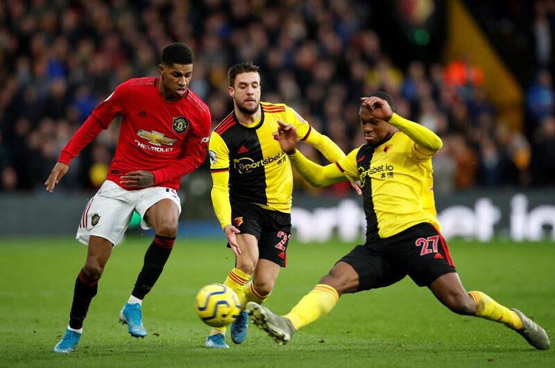 Manchester United's Marcus Rashford in action with Watford's Kiko Femenia and Christian Kabasele. Reuters