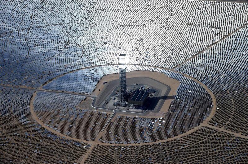 The 300,000 computer-controlled mirrors reflect sunlight to boilers that sit on 459-foot towers. The sun’s power is used to heat water in the boilers’ tubes and make steam, which in turn drives turbines to create electricity. Chris Carlson / AP Photo