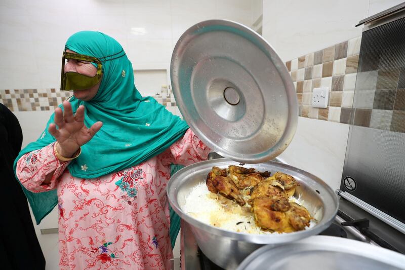 Ras al Khaimah, United Arab Emirates - May 26, 2019: Fatima Al Mulla, 65. Emirati Iftar at Hajar Al Mansouri house as part of the Emirati values iftar project led by the Federal Youth Foundation aims to educate people on traditional UAE values. the project will see Emiratis urged to host expatriates for iftar during Ramadan. Sunday the 26th of May 2019. Ras al Khaimah. Chris Whiteoak / The National