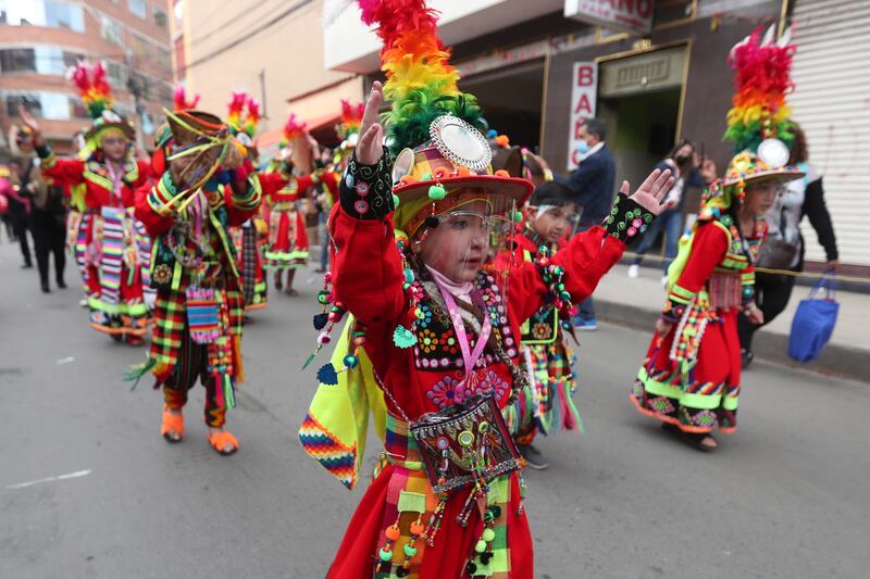 Children participate in the Gran Poder 'mini' dance parade in La Paz, Bolivia, 10 April 2022.  Little dancers premiered the title of World Heritage Site of the Great Power, the largest folk festival in La Paz, with a 'mini' parade of dances that emulated the one also known as the 'Feast of the Andes. '  EPA / MARTIN ALIPAZ