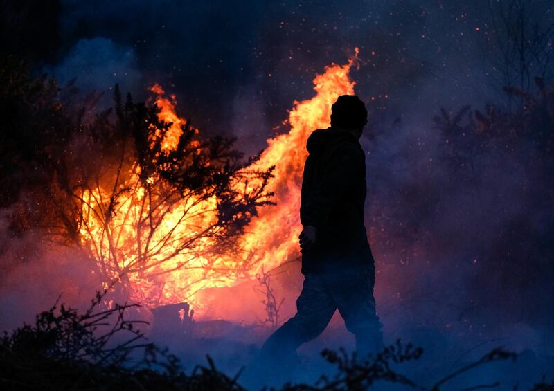 Members of the North Yorkshire Moors Moorland Organisation battle a gorse bush fire on moorland in Guisborough, England. Getty Images