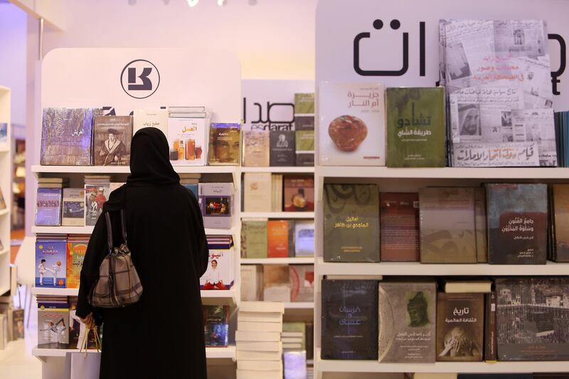SHARJAH , UNITED ARAB EMIRATES – Nov 4 , 2015 : People browsing the books at the book stalls on the first day of Sharjah International Book Fair at Expo Centre in Sharjah. ( Pawan Singh / The National ) For News *** Local Caption ***  PS0411- BOOK FAIR17.jpg