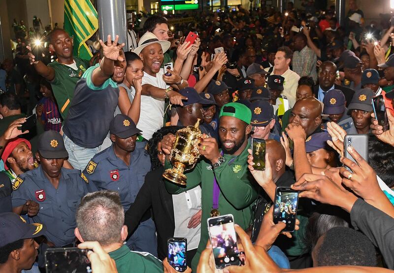 Captain of the South Africa Rugby World Cup winning team, Siya Kolisi, is greeted by thousands of supporters at O.R.Tambo International Airport on Thursday, November 7. EPA