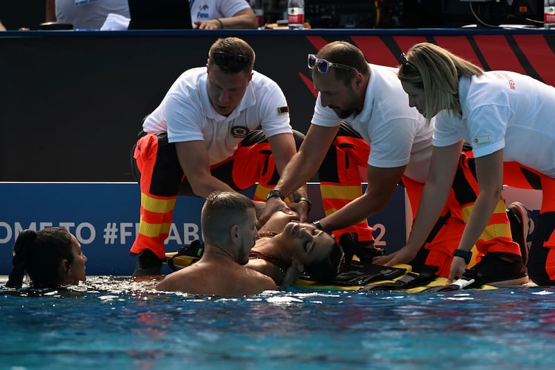 Anita Alvarez receives medical attention after fainting during the World Aquatics Championships. AP