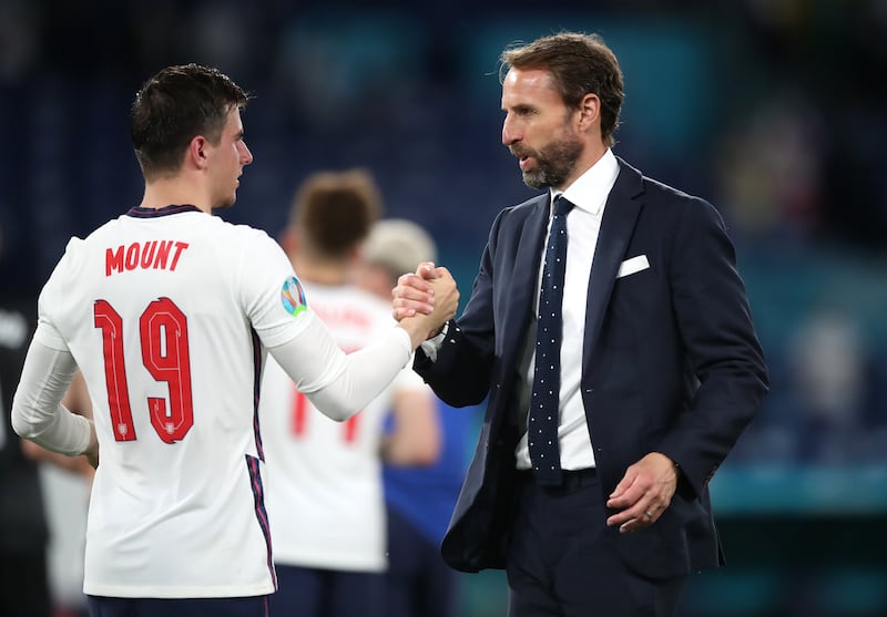 England manager Gareth Southgate shakes hands with Mason Mount.
