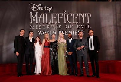 Cast members Harris Dickinson, Sam Riley, Jenn Murray, Michelle Pfeiffer, Angelina Jolie, Elle Fanning, Chiwetel Ejiofor, Ed Skrein and director Joachim Ronning pose during the premiere of "Maleficent: Mistress of Evil" in Los Angeles, California, U.S., September 30, 2019.  REUTERS/Mario Anzuoni