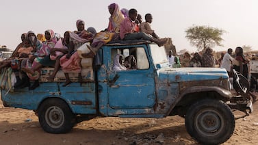 Refugees from Darfur in Sudan, sit on a vehicle before being taken to a camp on April 23, 2024, in Adre, Chad. Getty Images