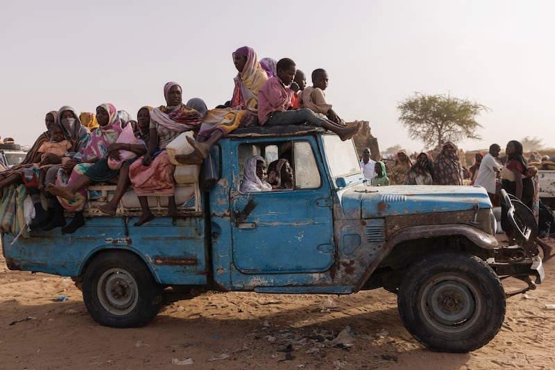 Refugees from Darfur in Sudan, sit on a vehicle before being taken to a camp on April 23, 2024, in Adre, Chad. Getty Images