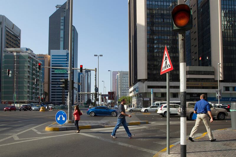 Abu Dhabi, United Arab Emirates, October 31, 2013:      

Pedestrians crossing Hamdan Street intersection  in Abu Dhabi on October 31, 2013. Mona Al Marzooqi / The National

Reporter: Ramona Ruiz
Section: National