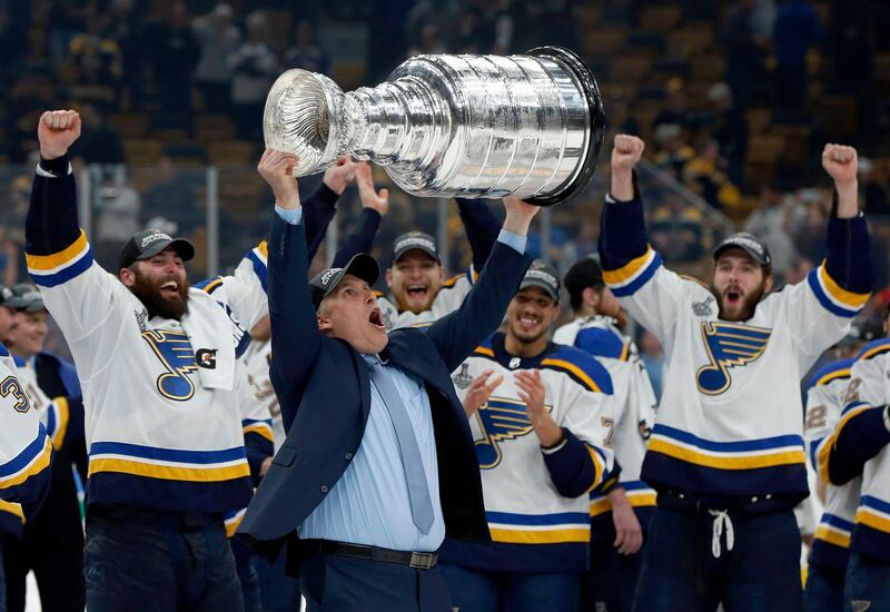 St. Louis Blues head coach Craig Berube carries the Stanley Cup after the Blues defeated the Boston Bruins in Game 7 of the NHL Stanley Cup Final in Boston. AP Photo