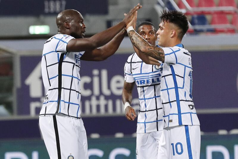 Inter's Romelu Lukaku celebrates with his teammate Lautaro Martinez after scoring against Bologna. EPA