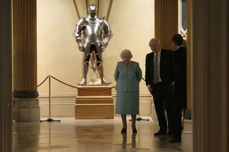 Queen Elizabeth and Mr Johnson meet attendees. PA