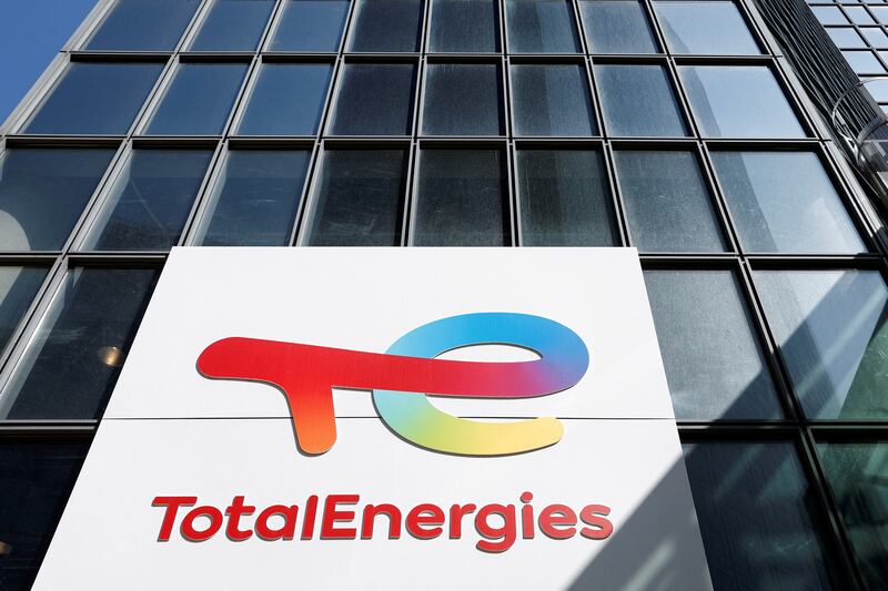 A TotalEnergies sign in Paris. The company is part of a consortium that will build the 1,500-megawatt Mphanda Nkuwa dam on the Zambezi river. Reuters