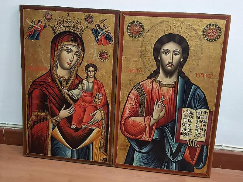 A picture taken on January 18, 2021 shows two 18th-century religious icons depicting Jesus and Mary that were stolen in Greece and were seized by Lebanese authorities during an auction in the capital Beirut. Lebanon handed back two 18th-century religious icons of Jesus and Mary to Greece today after they were seized during an auction on its soil, a judicial source said. The icons, which dated from before the 18th century and could have each fetched from 5,000 to 15,000 euros ($7,000-21,000), had been pilfered from unguarded monasteries and churches in the sparsely-populated region of Epirus in northwestern Greece. / AFP / -
