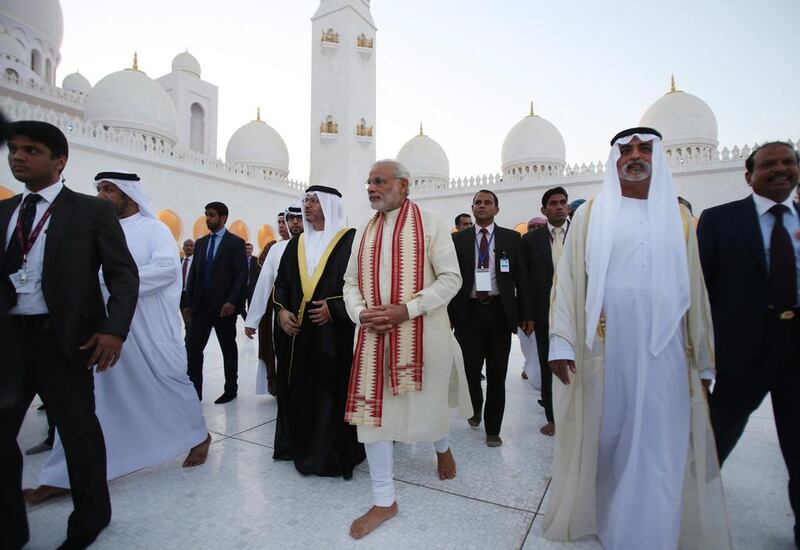 The Indian prime minister Narendra Modi visits the Sheikh Zayed Mosque on Sunday, accompanied by Sheikh Nahyan bin Mubarak, Minister of Culture, Youth and Community Development and Dr Anwar Gargash, Minister of State for Foreign Affairs. Kamran Jebreili / AP Photo
