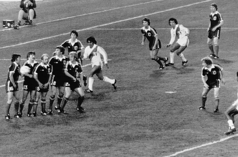 Scottish players forming a wall watch as the ball passes them into the goal for the third goal for Peru during the Football World Cup match between Scotland and Peru in Cordoba, Argentina on June 3, 1978. Peru defeated Scotland 3-1. (AP Photo)