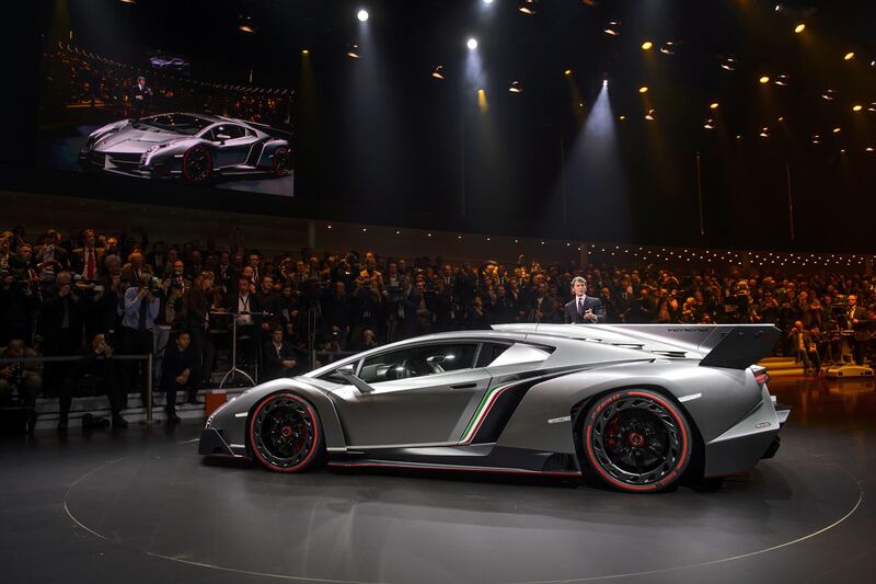 The new Lamborghini Veneno is presented by CEO and Chairman Stephan Winkelmann during a preview of Volkswagen Group on March 4, 2013 ahead of the Geneva Car Show in Geneva. AFP PHOTO / FABRICE COFFRINI
 *** Local Caption ***  620319-01-08.jpg