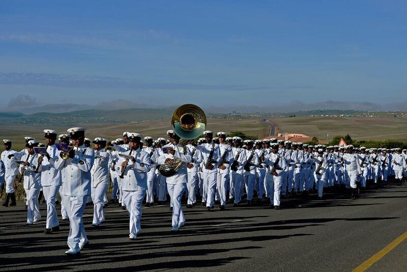 South African armed forces parade as they follow the funeral procession carrying the coffin of former South African President Nelson Mandela. Carl de Souza / AFP Photo

