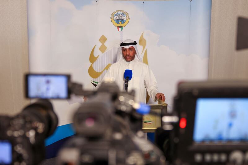 Mr Al Ghanim speaks to reporters. AFP