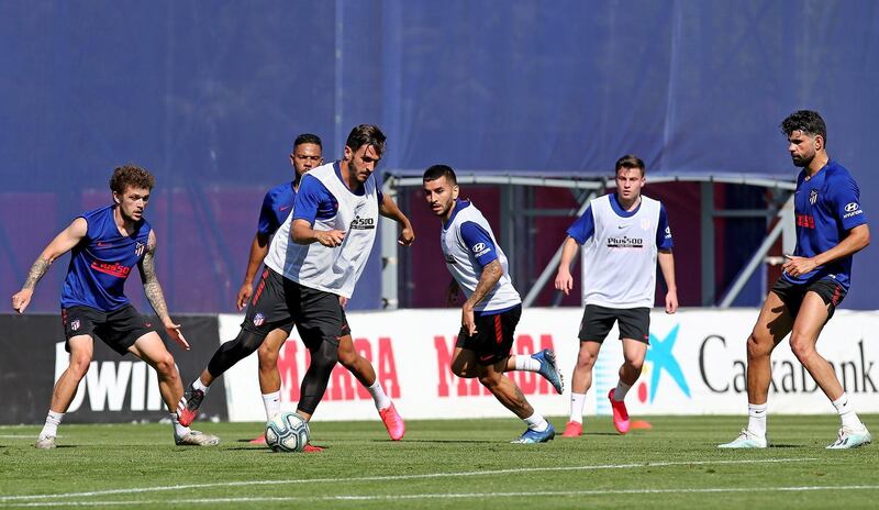Atletico Madrid players attend a training session at Cerro del Espino sports complex. EPA