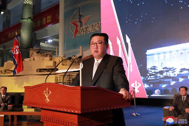 North Korea's leader Kim Jong-un, standing near military equipment on October 11.