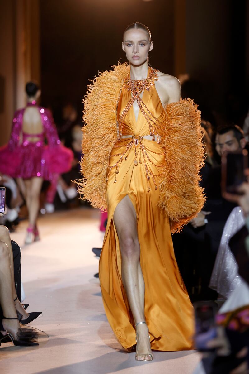 A gown in sunset orange at Zuhair Murad. Getty Images