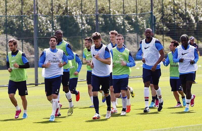 Arsenal players take part in a training session at their London Colney training ground in on Wednesday ahead of the FA Cup Final against Hull at Wembley Stadium on Satuday. Carl Court / AFP / May 14, 2014