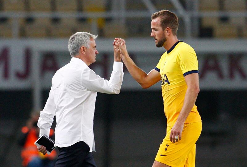 Tottenham Hotspur manager Jose Mourinho shakes hands with Harry Kane after the match. Reuters