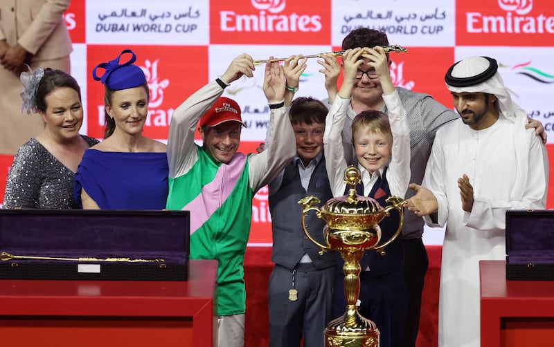 UAE champion jockey Tadhg O'Shea celebrates with the trophy after winning the Dubai World Cup on Laurel River. Reuters