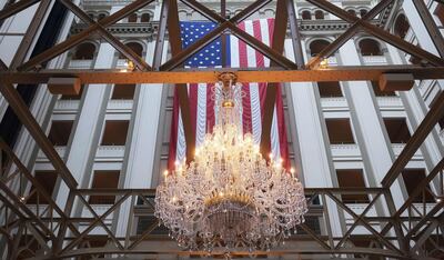 WASHINGTON, DC - FEBRUARY 03: The American flag hangs in the Trump International Hotel on February 03, 2020 in Washington, DC. Closing arguments began Monday after the Senate voted to block witnesses from appearing in the impeachment trial. The final vote is expected on Wednesday.   Mario Tama/Getty Images/AFP
== FOR NEWSPAPERS, INTERNET, TELCOS & TELEVISION USE ONLY ==
