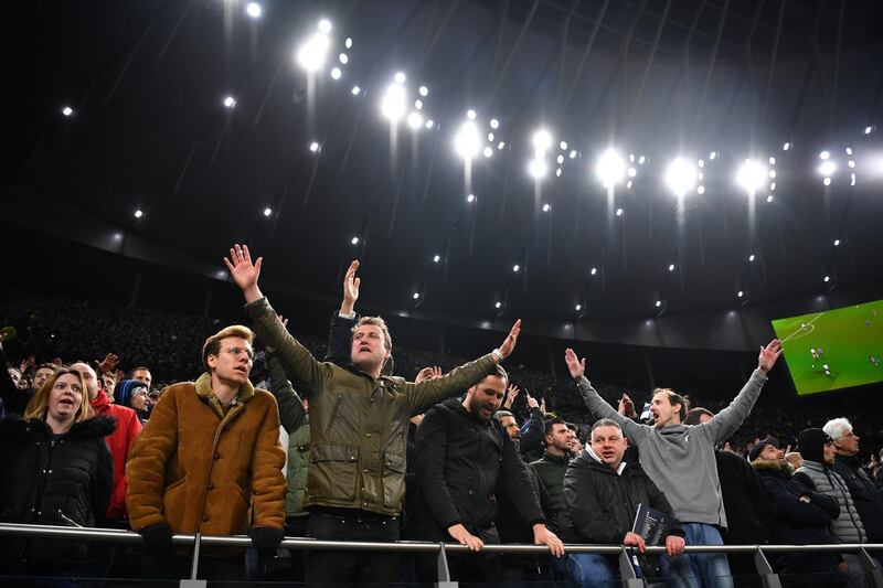 Tottenham Hotspur fans watch on. Reuters