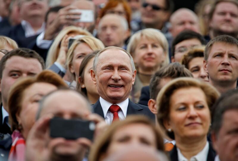 FILE PHOTO: Russian President Vladimir Putin (C) watches the celebrations for the City Day in Moscow, Russia September 10, 2016. REUTERS/Sergei Karpukhin/File Photo