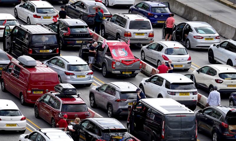 Liverpool supporters heading for the Champions League final in Paris wait among freight and holiday traffic queues at the Port of Dover in Kent. PA