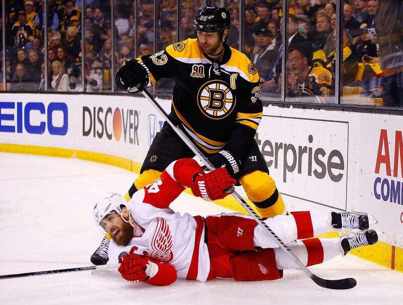 Boston defender Zdeno Chara, top, considered one of the best players in the NHL, stands over Henrik Zetterberg of the Detroit Red Wings during a first-round NHL play-off game on Saturday. Jared Wickerham/Getty Images