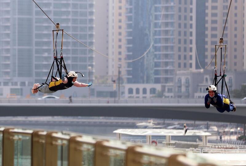 Dubai, United Arab Emirates - Reporter: N/A. Lifestyle. Maram (L) and Maryam Makki are one of the first people to come down the XLine Dubai in the Marina after re opening due to Covid-19. Wednesday, June 2nd, 2020. Dubai. Chris Whiteoak / The National