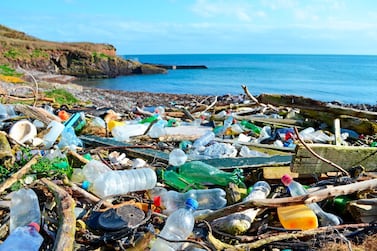 Plastic bottles and other garbage wash up on a beach in the county of Cork in Ireland. Getty Images