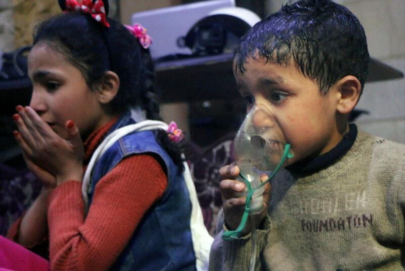 A child receiving oxygen through respirators following an alleged poison gas attack in the rebel-held town of Douma on Sunday, April 8, 2018.  Syrian Civil Defense White Helmets via AP