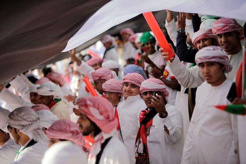 UAE fans celebrate as the UAE Olympic team plays Australia for a Olympic qualifier game in Abu Dhabi.  Sammy Dallal / The National