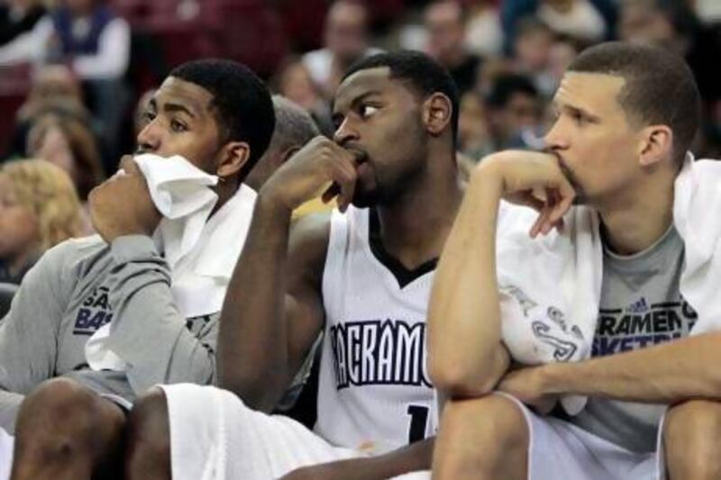 Sacramento Kings players, from left, Jason Thompson, Tyreke Evans and Francisco Garcia watch during the closing moments of their NBA basketball game against the Miami Heat in Sacramento, Calif., Saturday, Jan. 12, 2013. The Heat won 128-99. (AP Photo/Rich Pedroncelli) *** Local Caption *** HeatKings Basketball.JPEG-05fa7.jpg