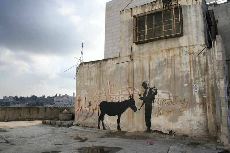 A Banksy satirical take on security checks around Palestine. Courtesy PicturesonWalls