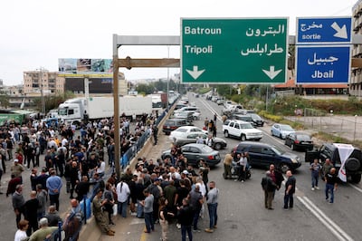 Supporters of the Lebanese Forces Party block a highway near Byblos in protest over the death of Mr Sleiman. Reuters