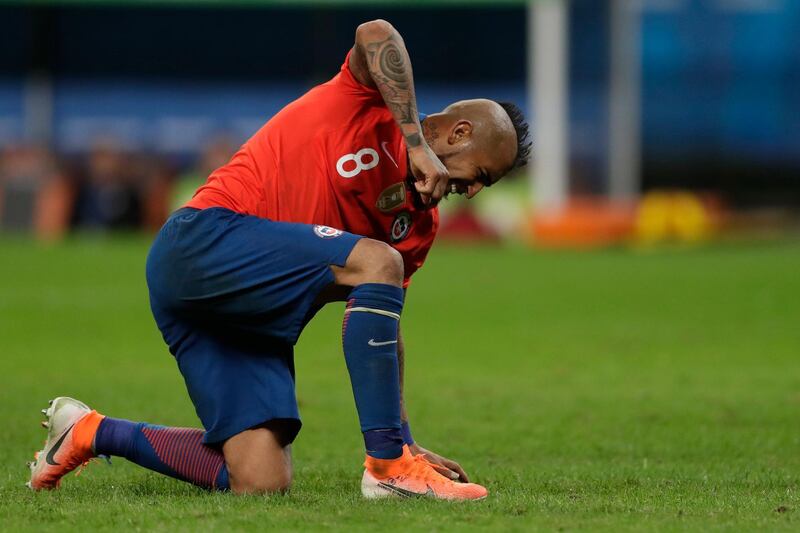 Chile's Arturo Vidal reacts after missing a chance to score against Peru during a Copa America semifinal soccer match at the Arena do Gremio in Porto Alegre, Brazil. Peru defeated Chile 3-0 and advances to the final with Brazil. AP