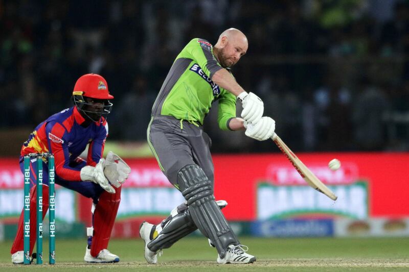 Ben Dunk of Lahore Qalandars plays a shot against Karachi Kings. EPA