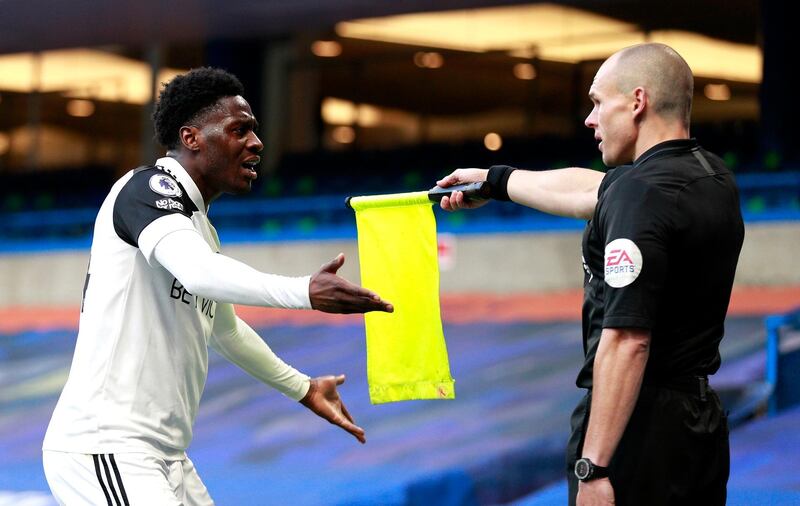 Fulham's Ola Aina argues with the assistant referee. PA