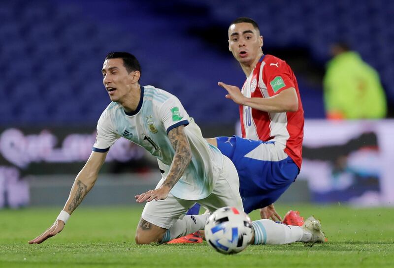 Argentina's Angel Di Maria is fouled by Miguel Almiron of Paraguay. Reuters