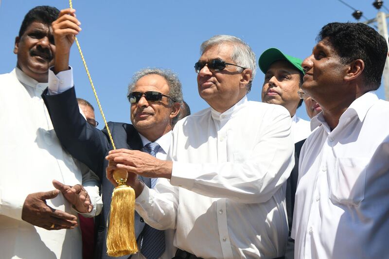 Sri Lanka Prime Minister Ranil Wickremesinghe and Oman Oil and Gas Minister Mohammed bin Hamad Al Rumhy unveil a plaque marking the construction of a $3.85 billion oil refinery and storage complex in the southern port city of Hambantota.  AFP