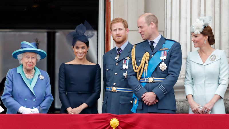 From left, Queen Elizabeth, Meghan, Duchess of Sussex, Prince Harry, Prince William and Kate, Duchess of Cambridge, at Buckingham Palace.