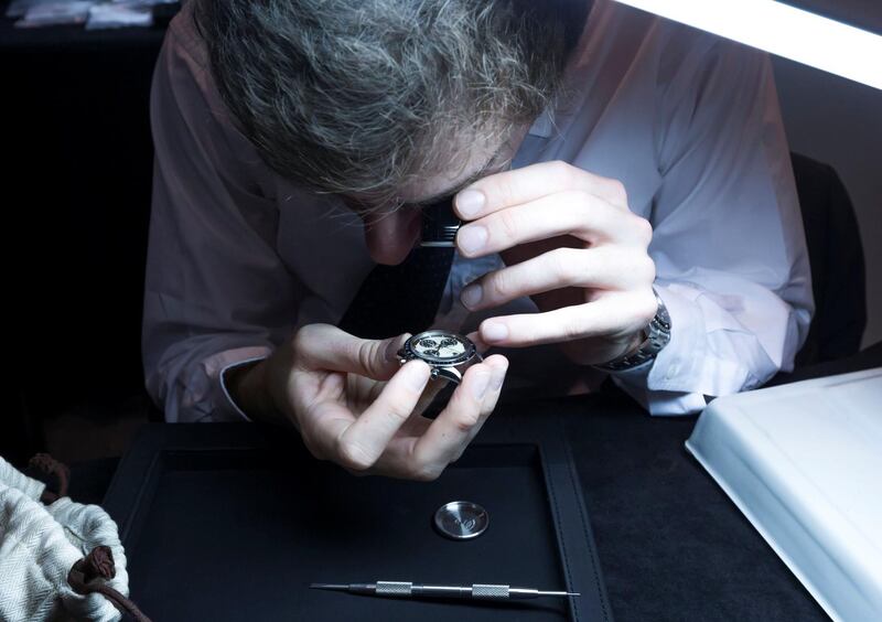 DUBAI, UNITED ARAB EMIRATES - A watch expert checking the authenticity of a watch at the behind the scene unveiling of Christie's auction at Emirates Tower Hotel, Dubai.  Leslie Pableo for the National for Nada El Sawy's story